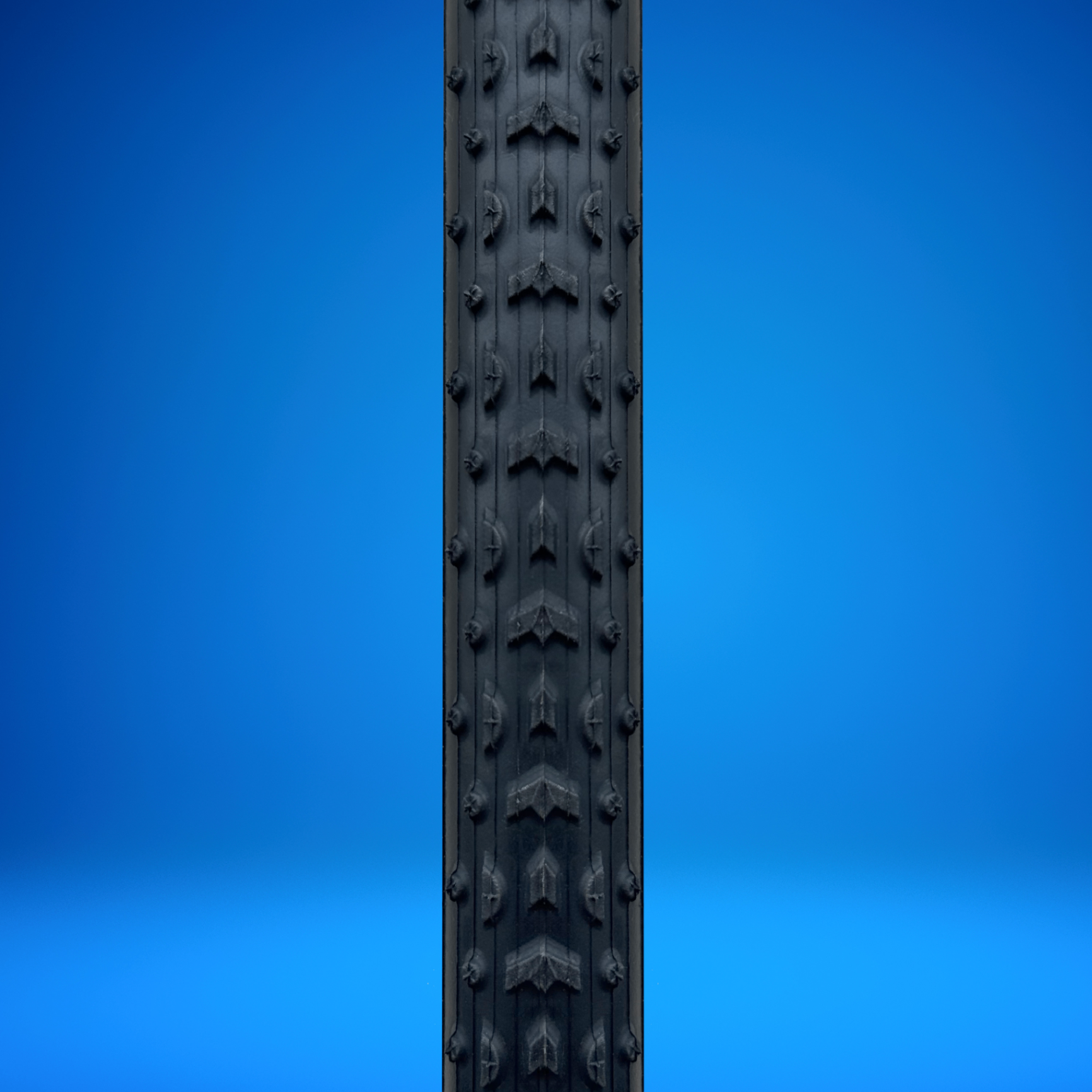NJCX anniversary blue sidewall Grifo tire, tread close-up