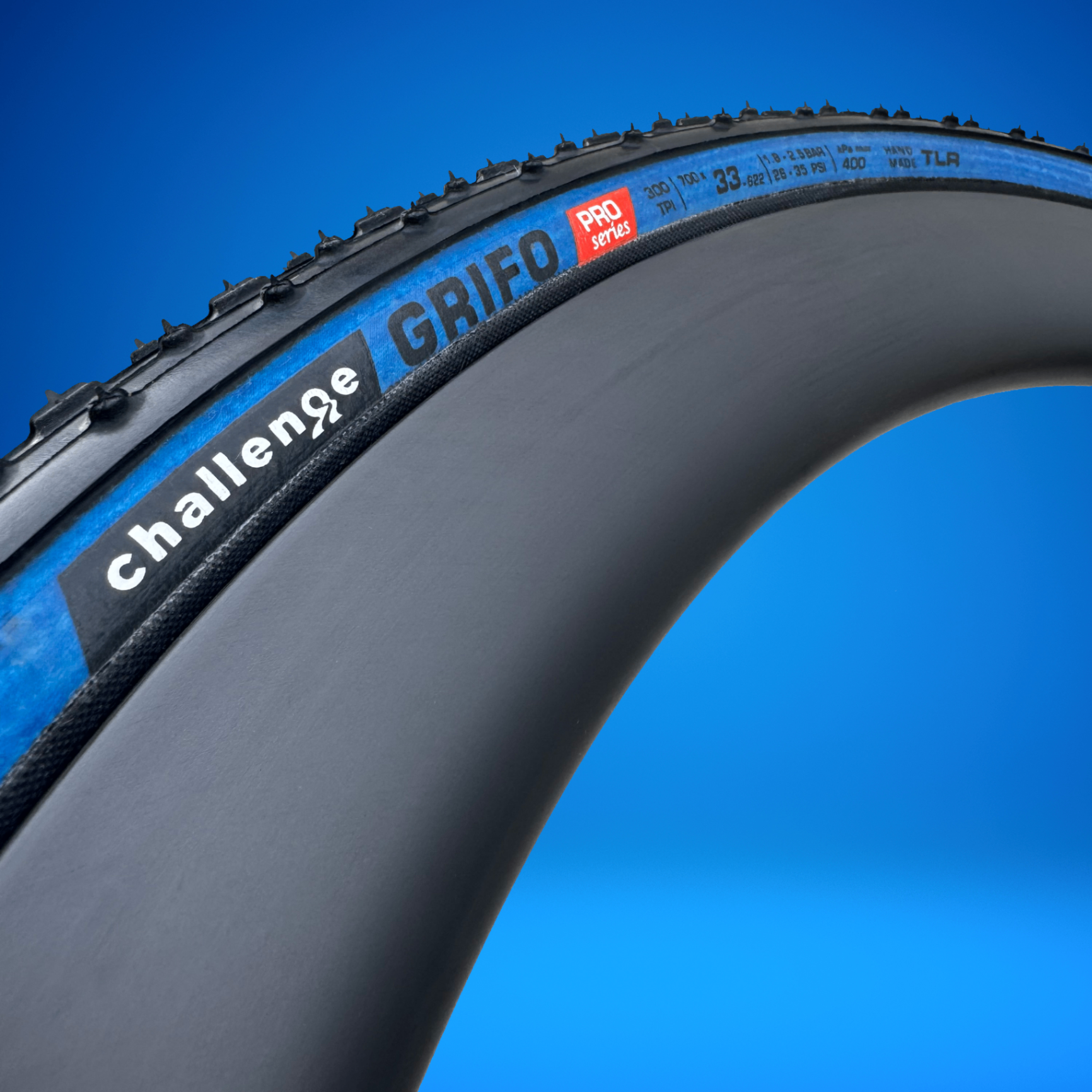NJCX anniversary blue sidewall Grifo tire, close-up of logo
