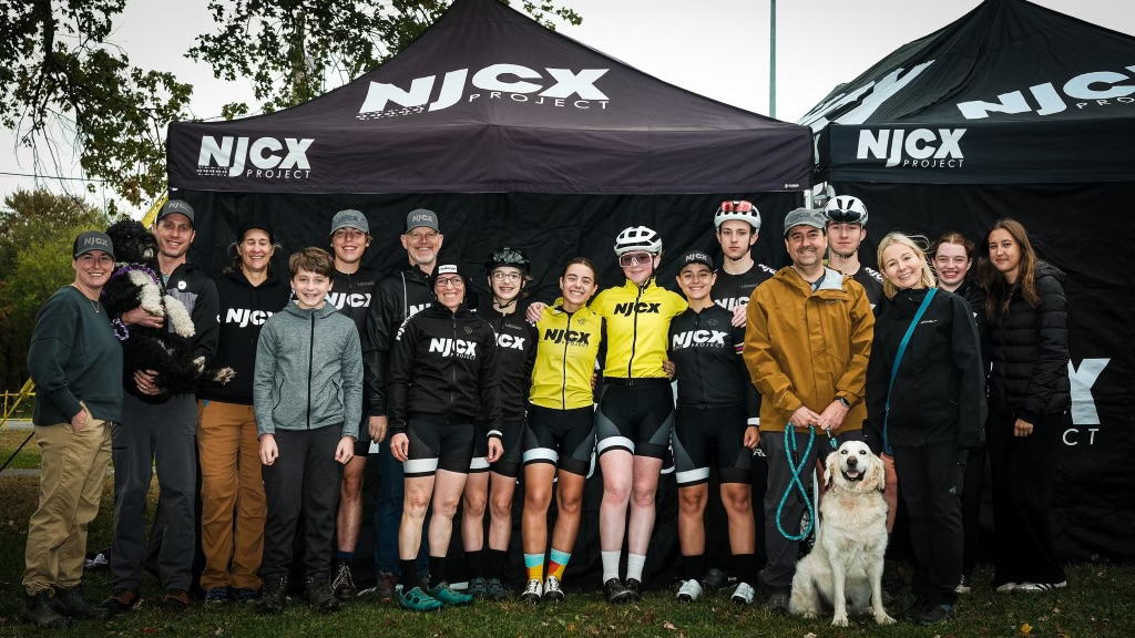 NJCX team and families under the tent