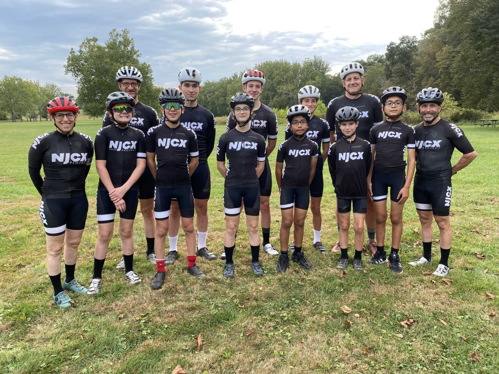 NJCX riders and families along a cold morning cyclocross course